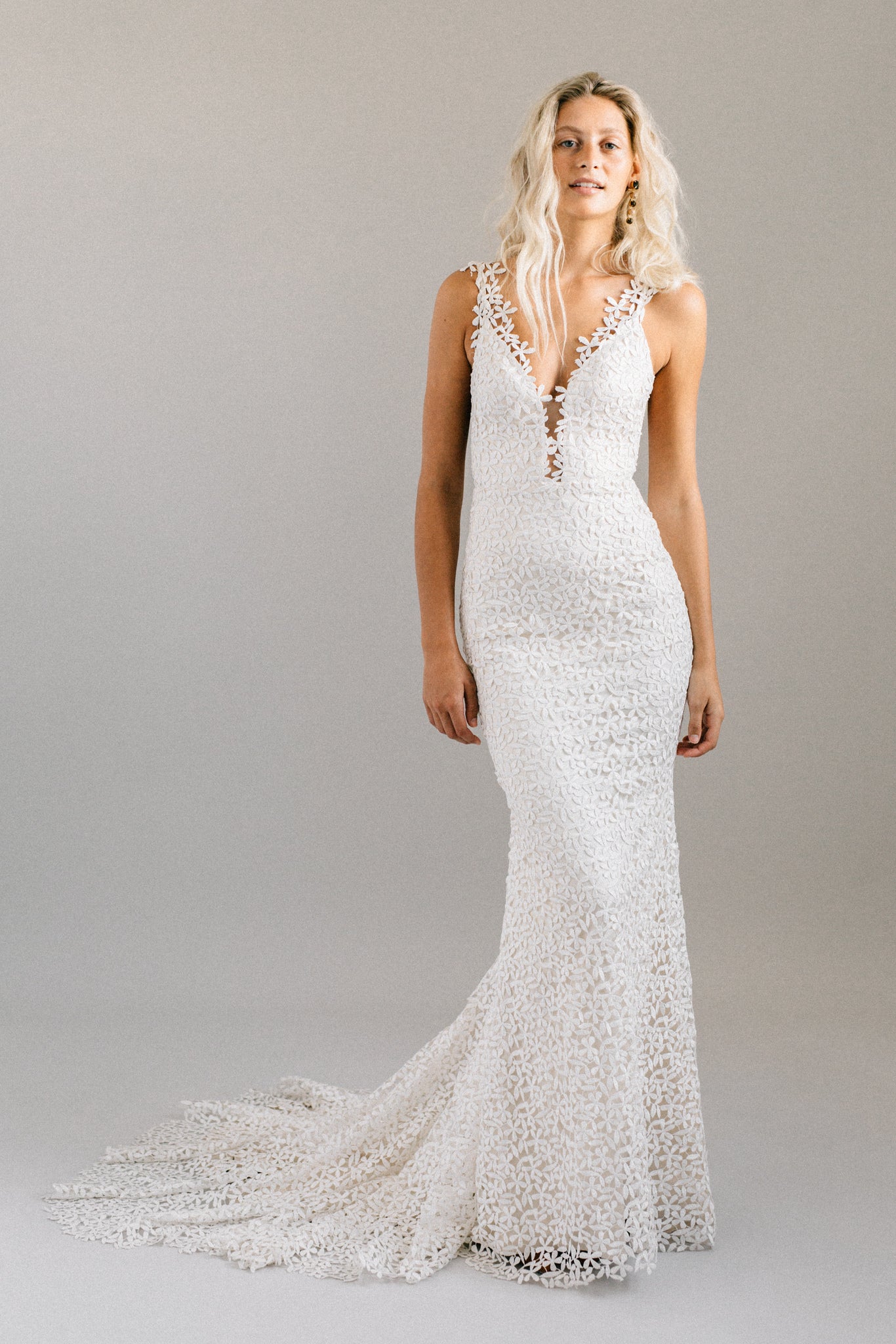 Flower print mermaid wedding dress with an open back, extra long train and a plunging neckline
